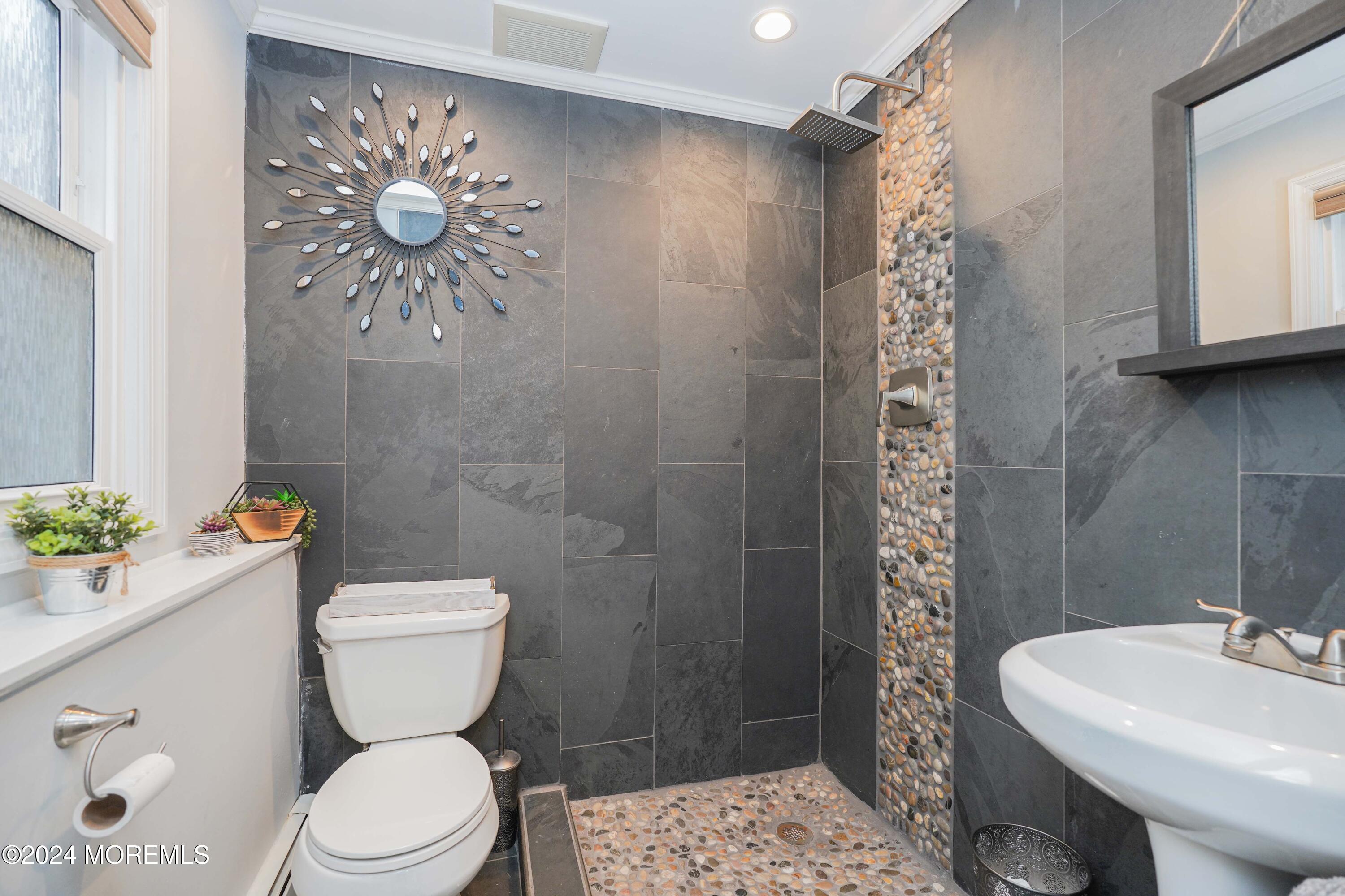 13 Bartle Road Somerset, NJ 08873 - Photo 18 of 26 a bathroom with a toilet sink and shower curtain