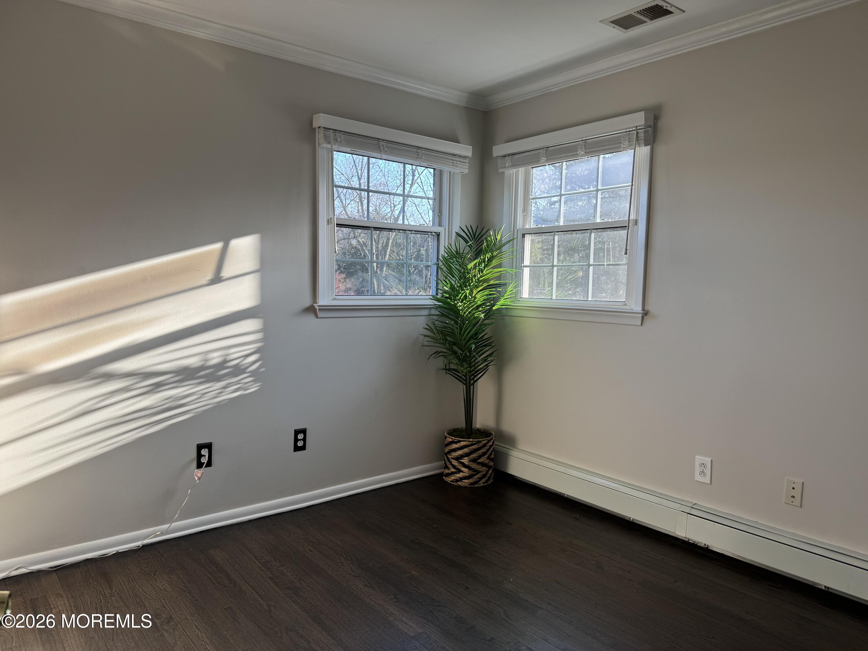 13 Bartle Road Somerset, NJ 08873 - Photo 19 of 26 an empty room with wooden floor and windows