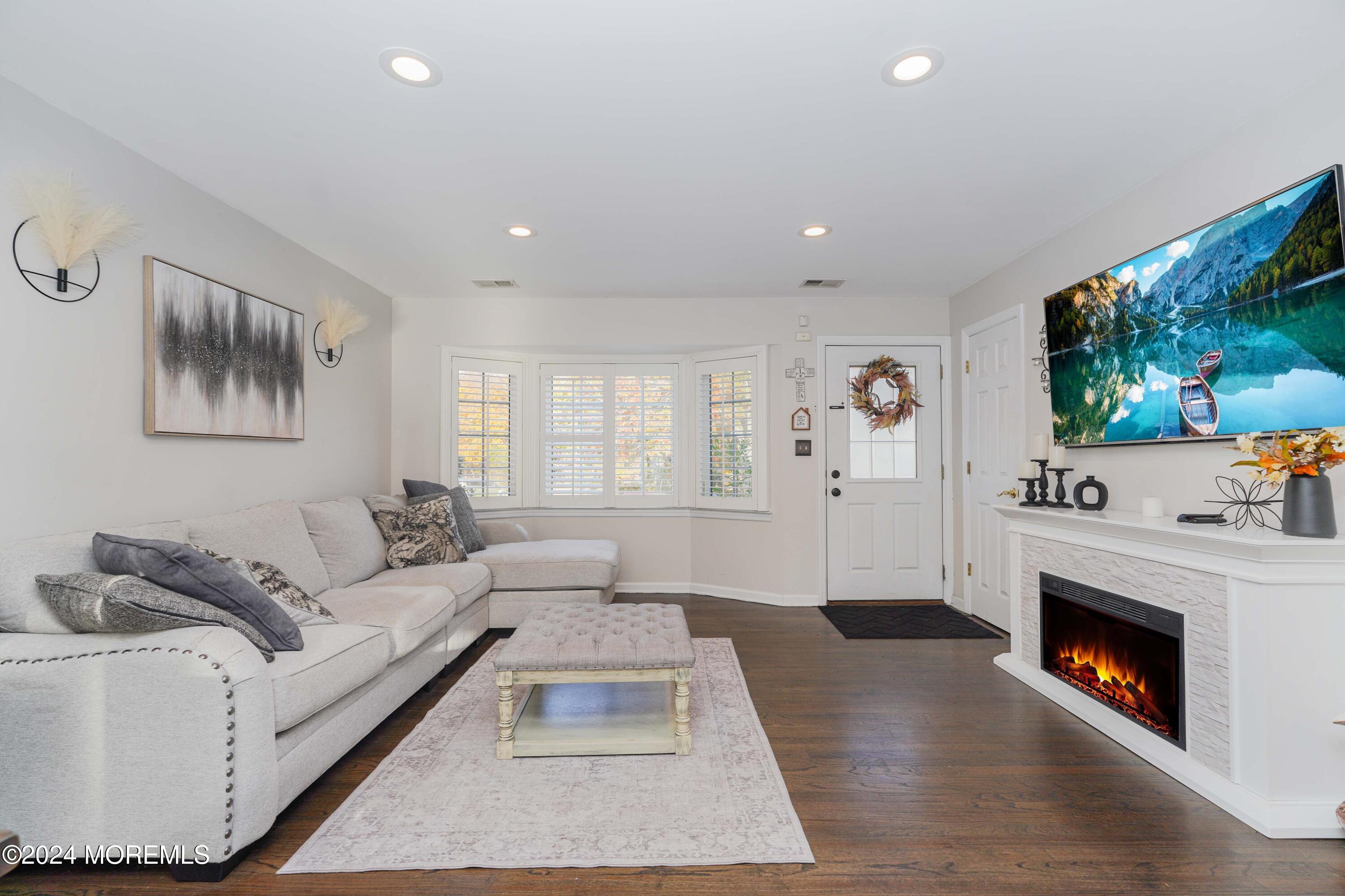 13 Bartle Road Somerset, NJ 08873 - Photo 3 of 26 a living room with furniture and a fireplace