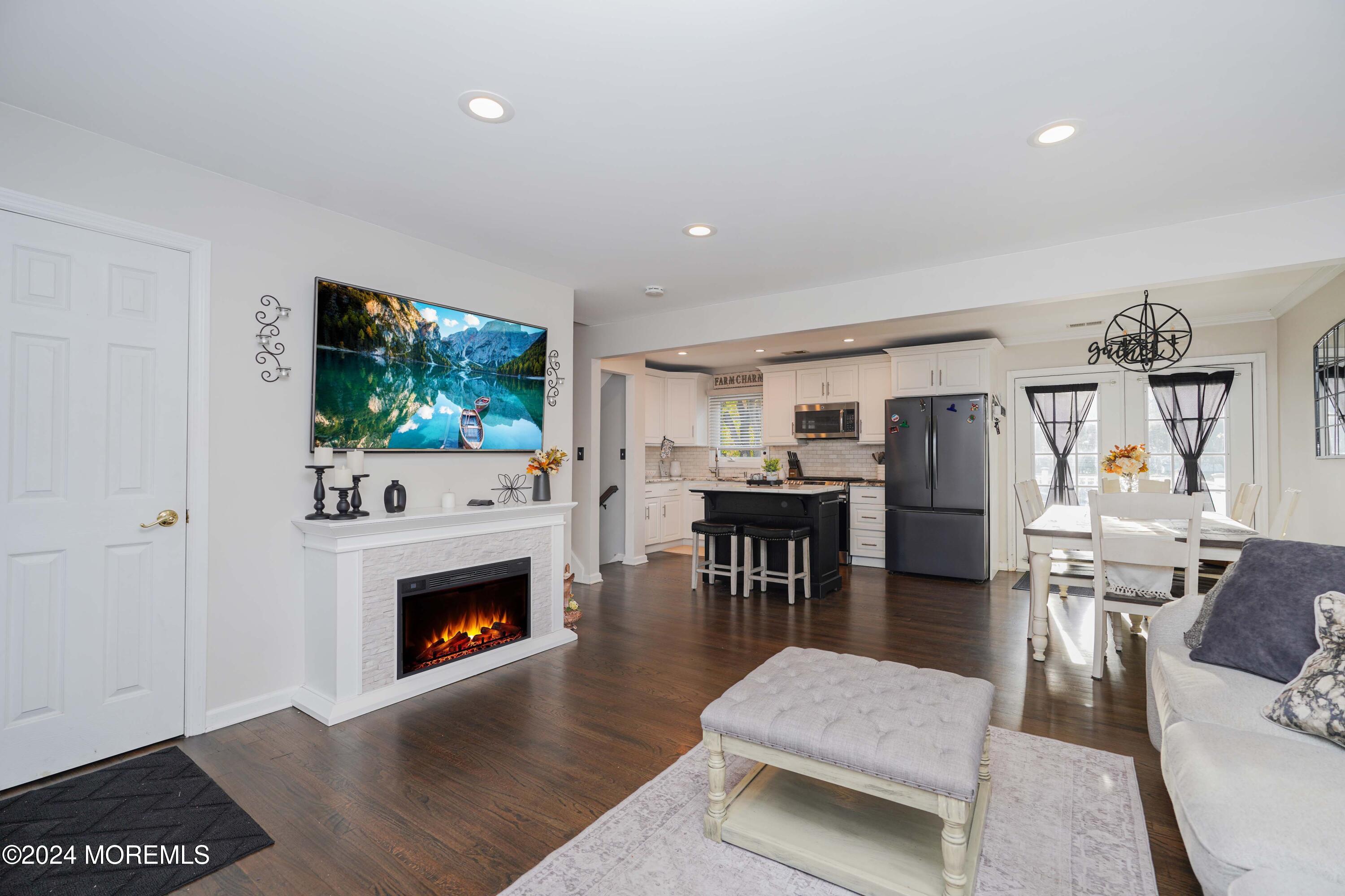 13 Bartle Road Somerset, NJ 08873 - Photo 5 of 26 a living room with furniture and a fireplace