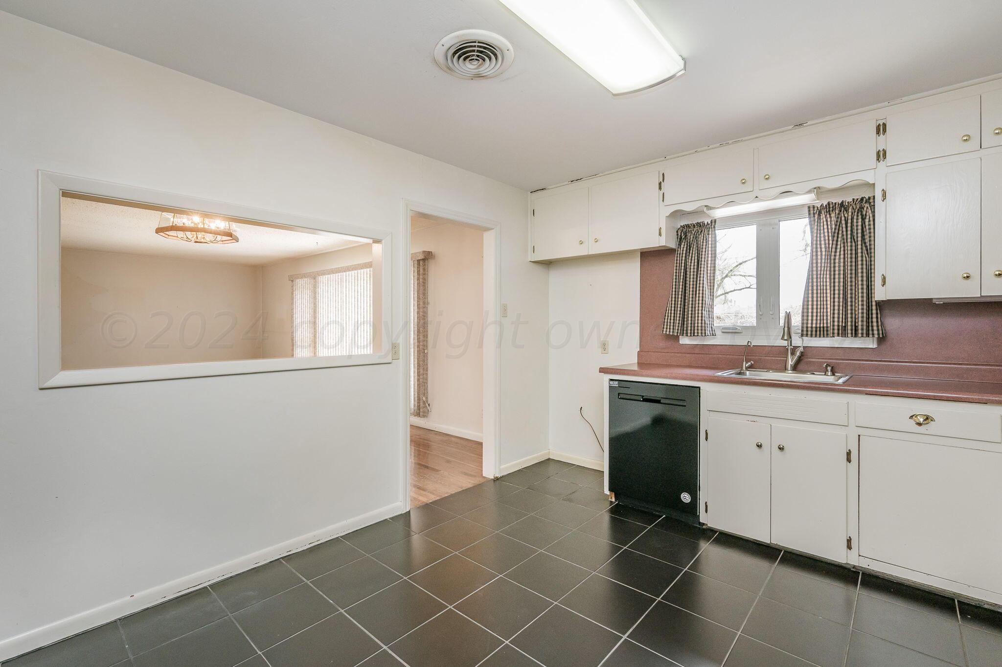3415 Paramount Boulevard Amarillo, TX 79109 - Photo 16 of 44 a spacious bathroom with a sink mirror and a shower