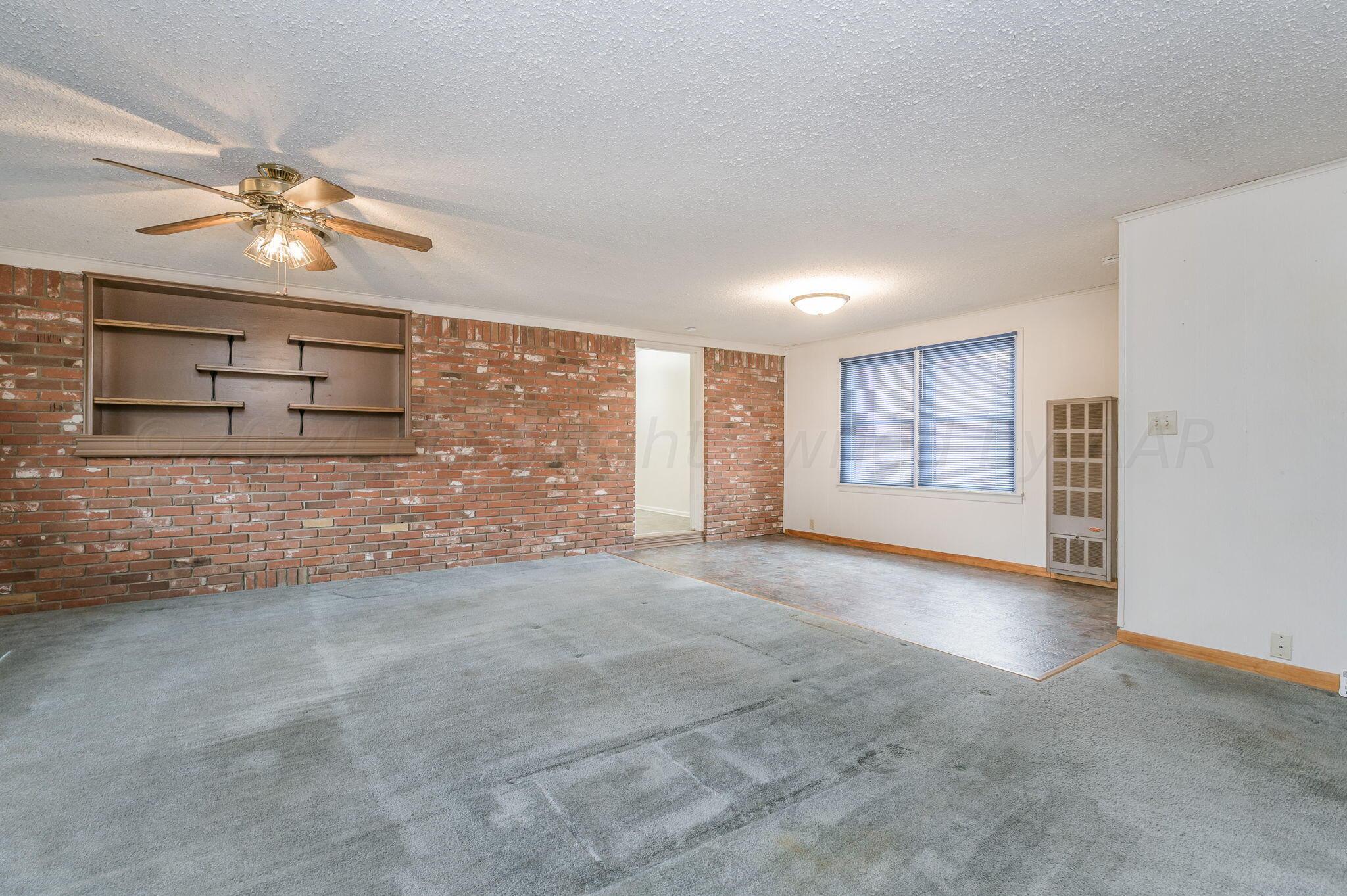 3415 Paramount Boulevard Amarillo, TX 79109 - Photo 19 of 44 a view of an empty room with a window