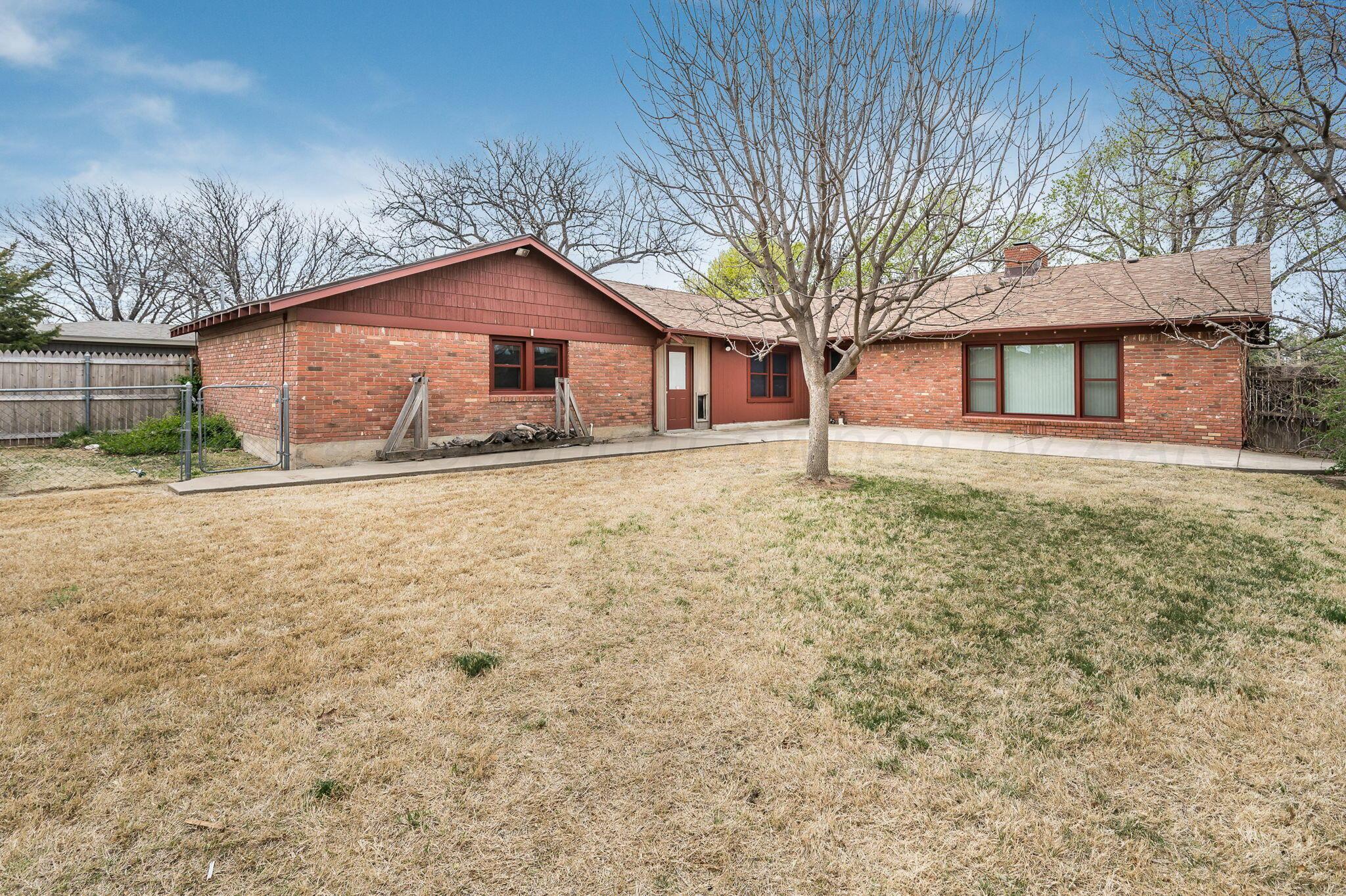 3415 Paramount Boulevard Amarillo, TX 79109 - Photo 27 of 44 front view of a house with a yard