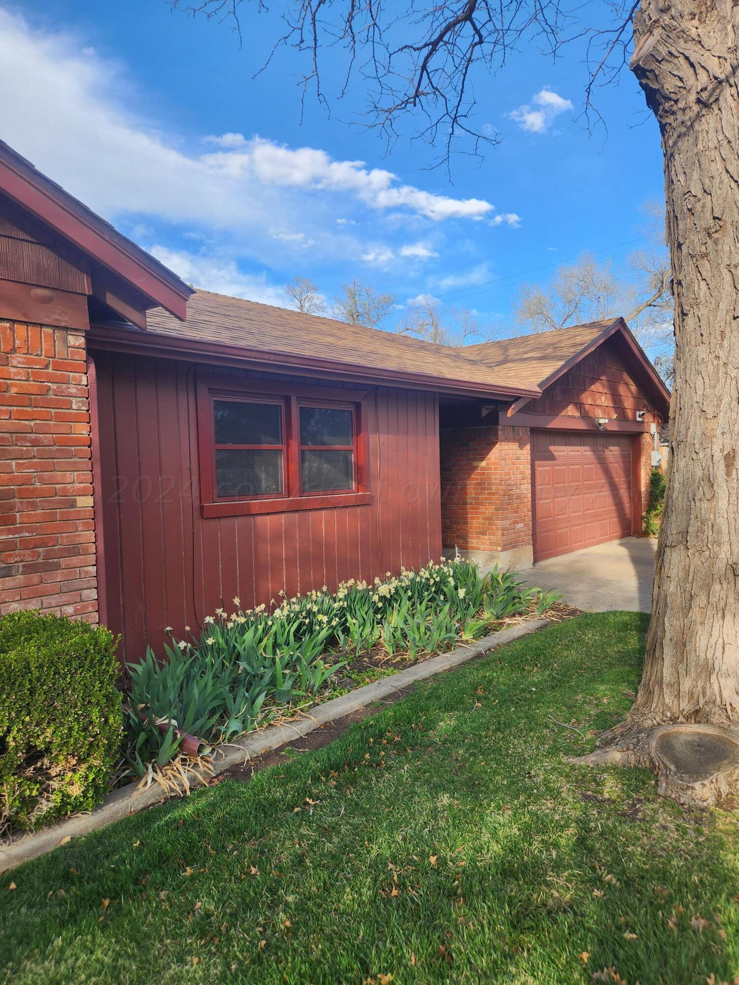 3415 Paramount Boulevard Amarillo, TX 79109 - Photo 7 of 44 a view of a backyard of the house