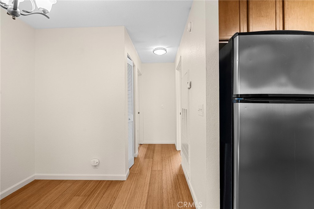 1114 Nord Avenue, Unit 8 Chico, CA 95926 - Photo 11 of 40 a view of a hallway with wooden floor