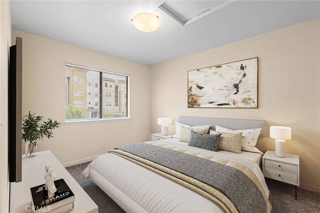 1114 Nord Avenue, Unit 8 Chico, CA 95926 - Photo 19 of 40 a bedroom with a bed and a painting on the wall