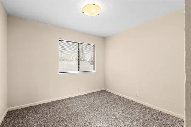 a bedroom with a bed and a cabinets