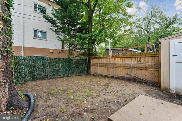 a view of backyard with green space