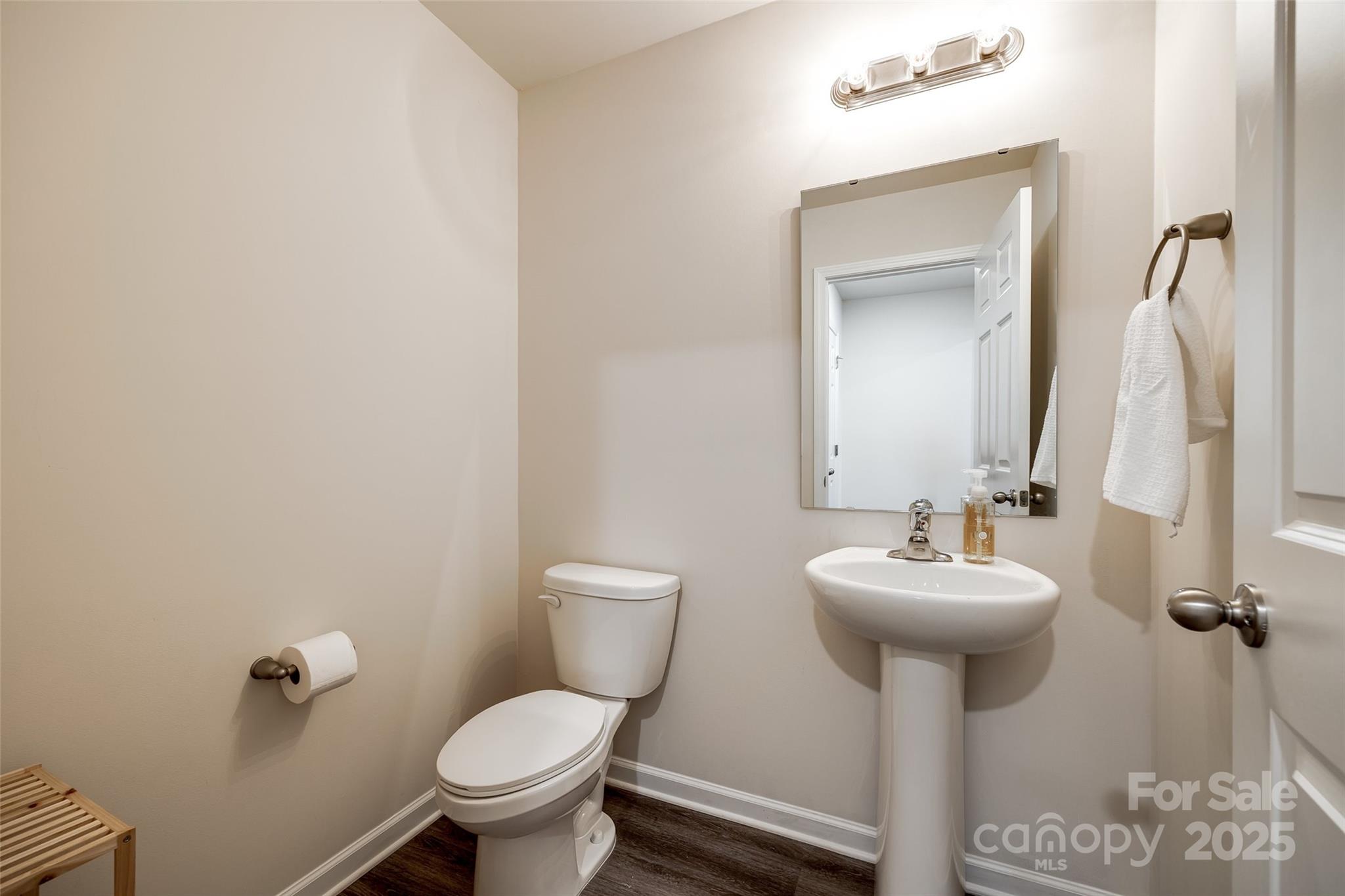 415 Kickapoo Avenue Gastonia, NC 28056 - Photo 12 of 24 a bathroom with a toilet sink and mirror