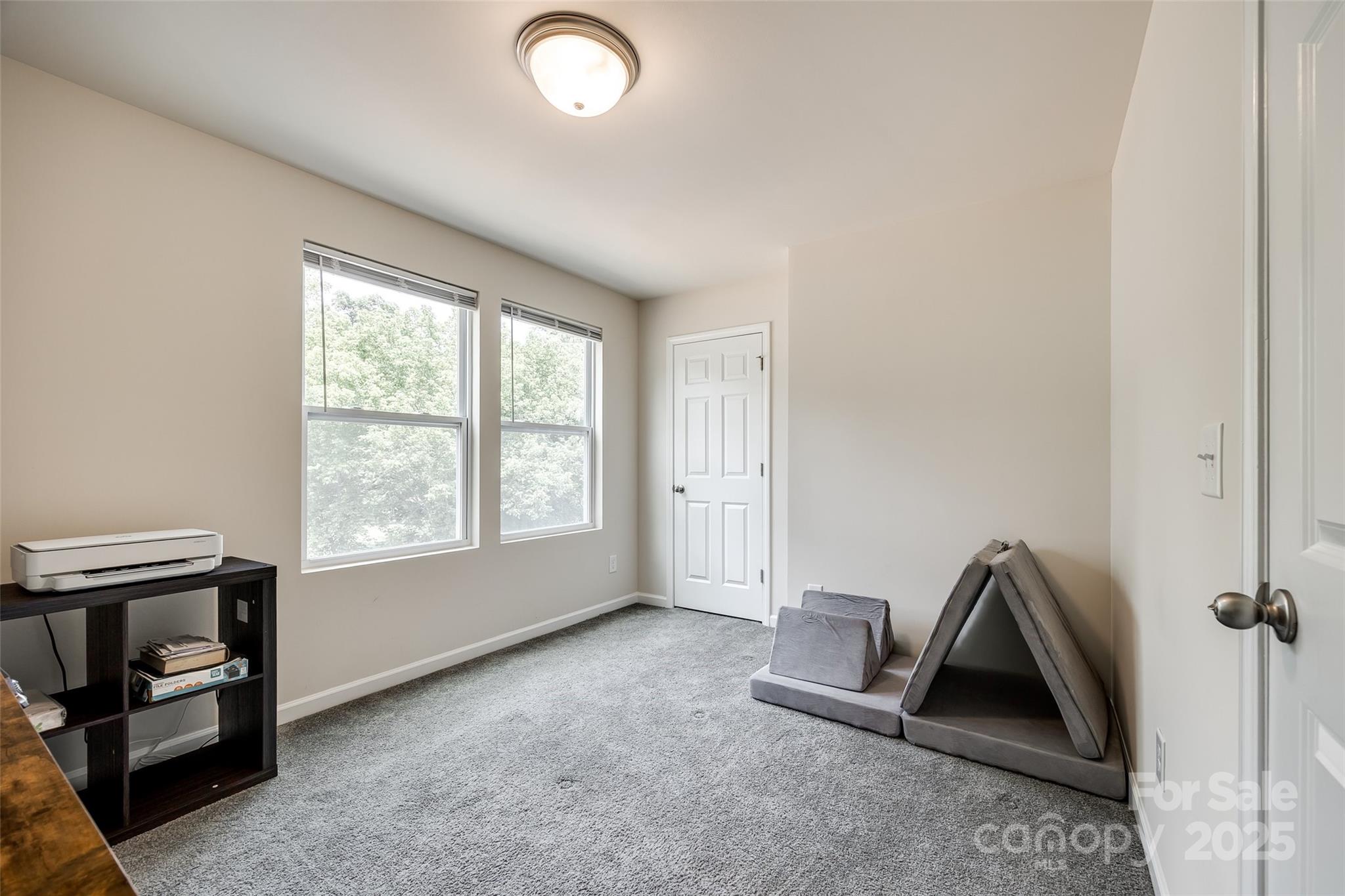 415 Kickapoo Avenue Gastonia, NC 28056 - Photo 14 of 24 an empty room with windows