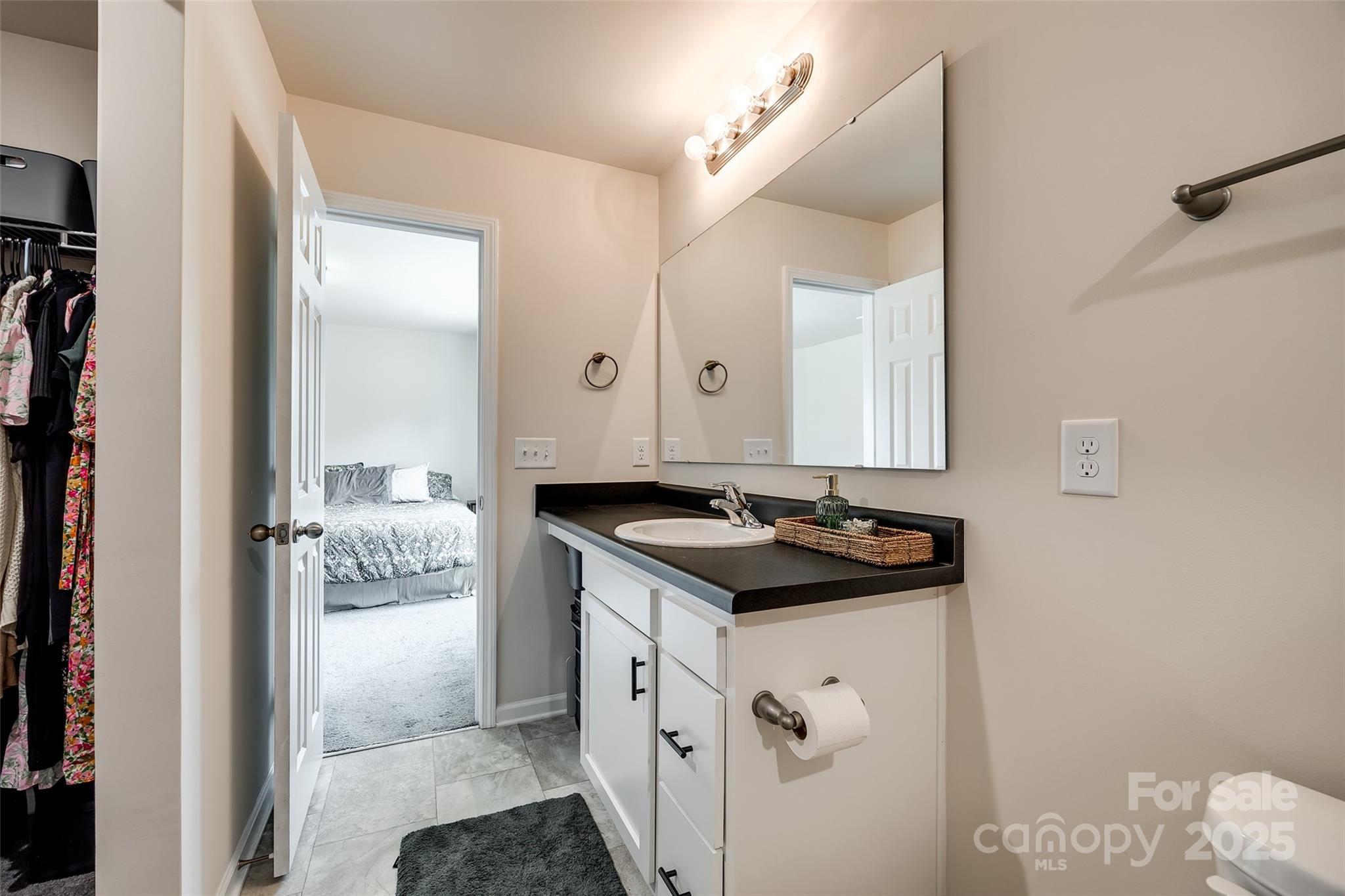 415 Kickapoo Avenue Gastonia, NC 28056 - Photo 20 of 24 a bathroom with a sink and a mirror