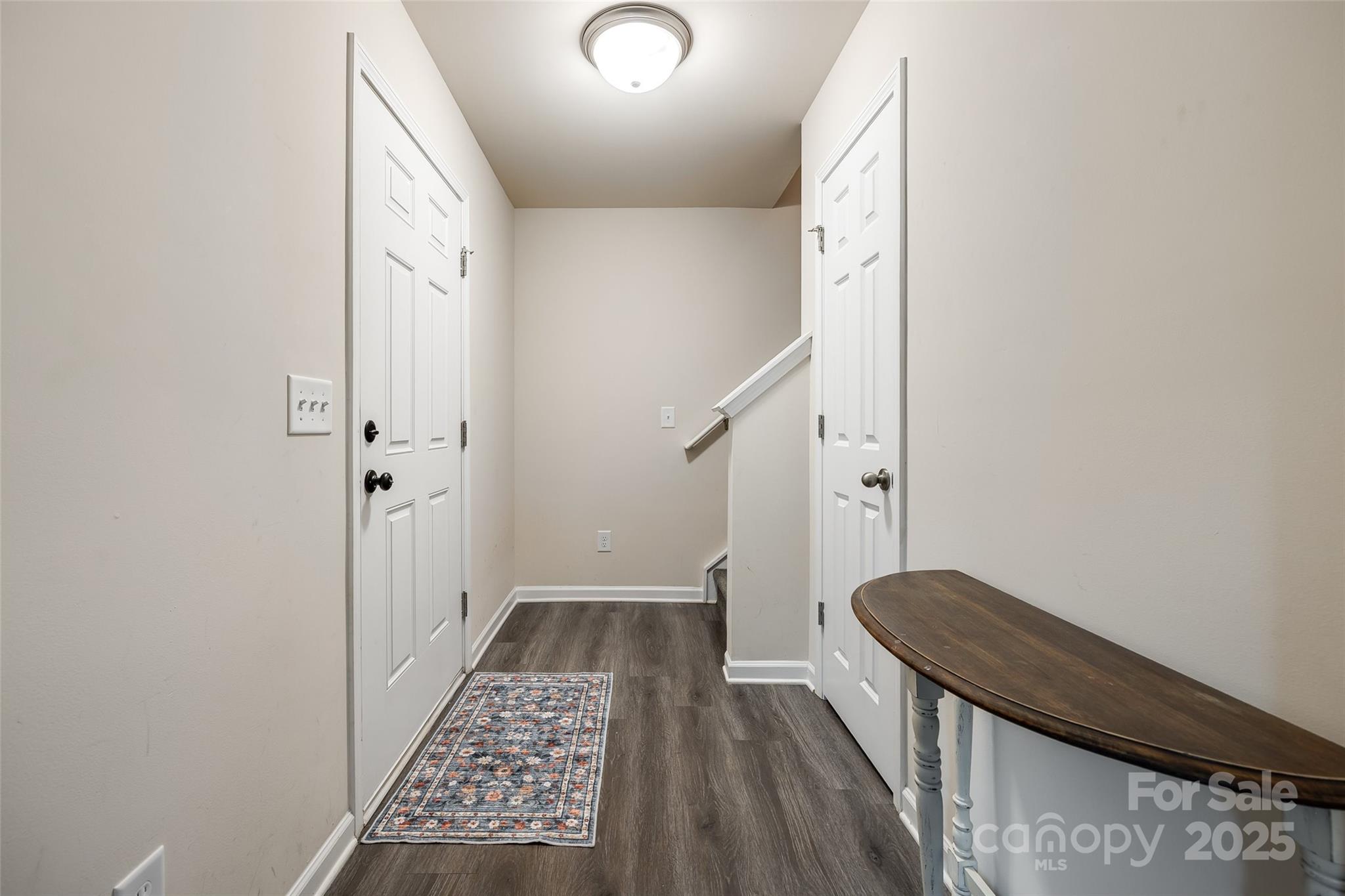 415 Kickapoo Avenue Gastonia, NC 28056 - Photo 4 of 24 a view of a hallway with wooden floor and staircase