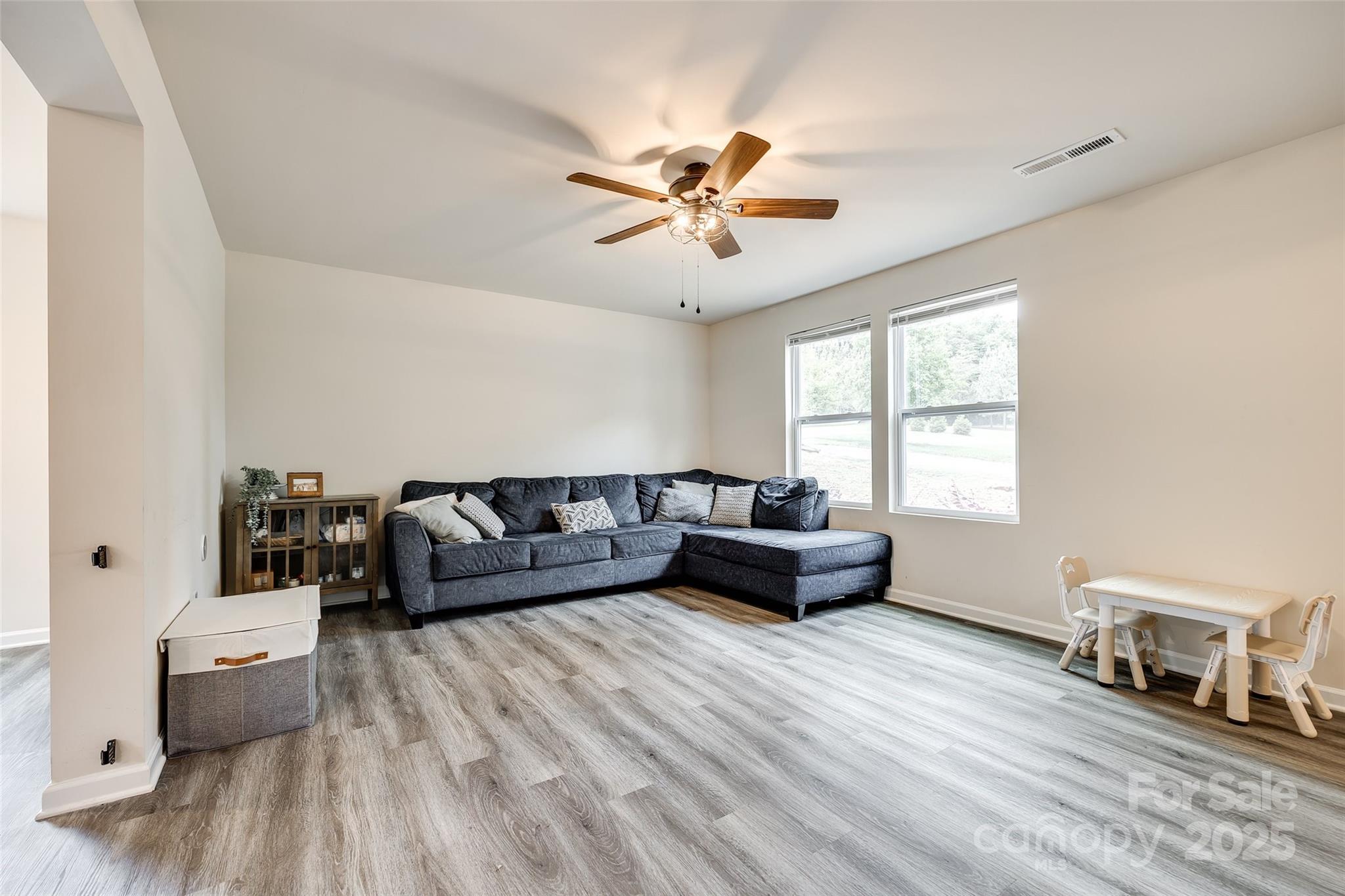 415 Kickapoo Avenue Gastonia, NC 28056 - Photo 6 of 24 a living room with furniture and a wooden floor