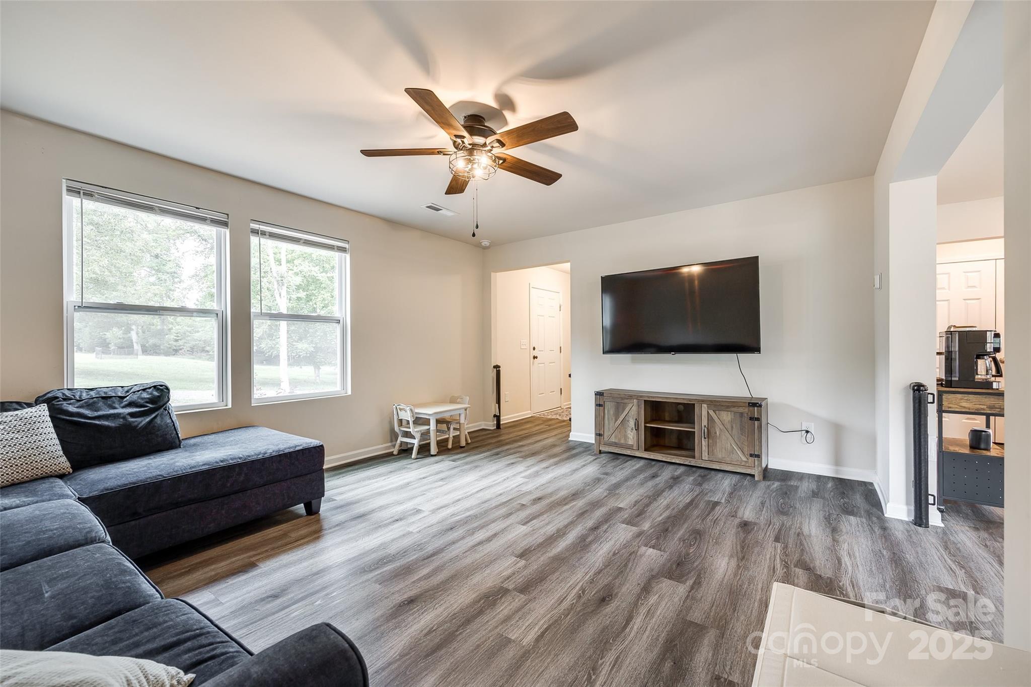 415 Kickapoo Avenue Gastonia, NC 28056 - Photo 7 of 24 a living room with furniture and a flat screen tv