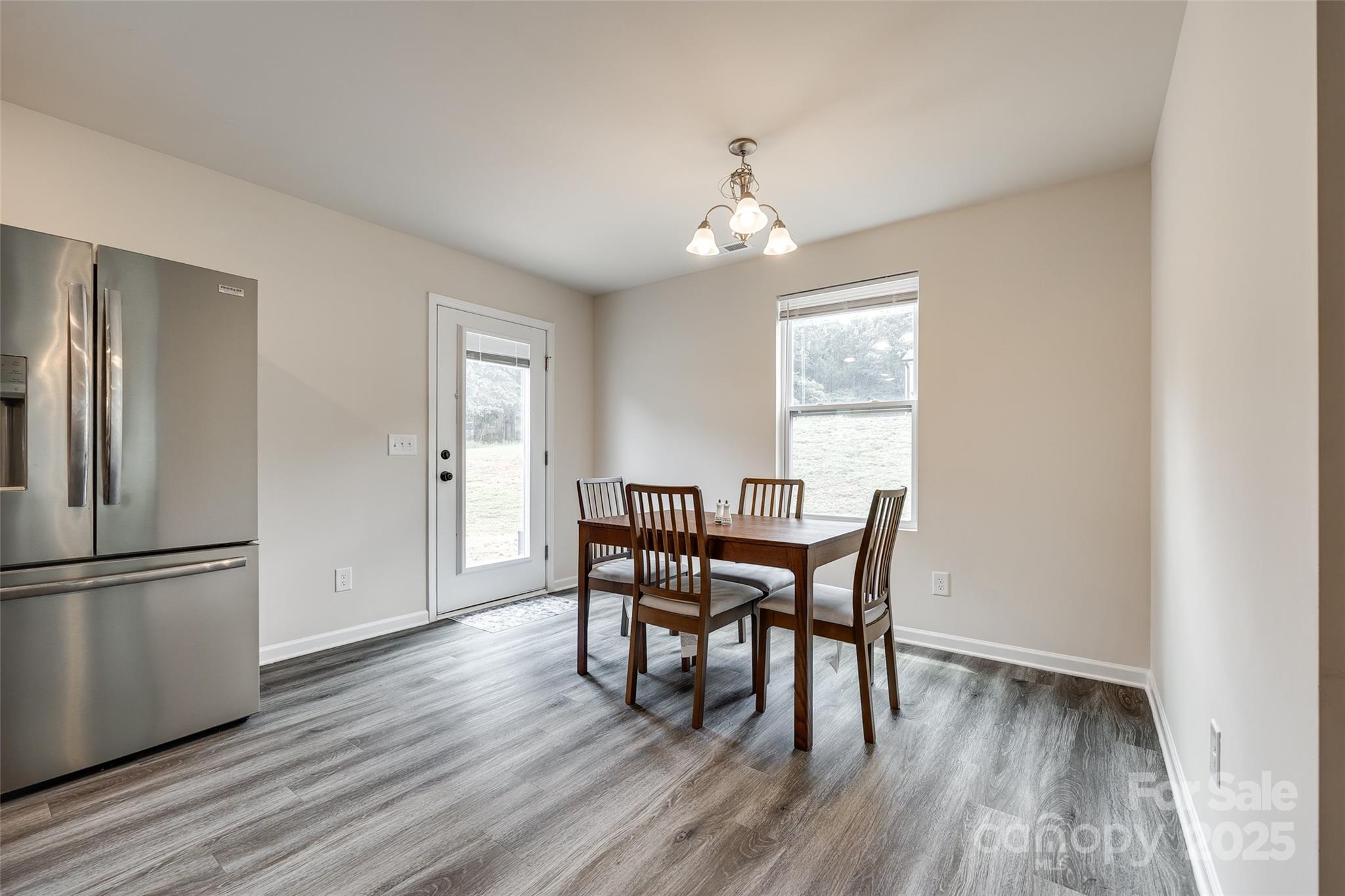 415 Kickapoo Avenue Gastonia, NC 28056 - Photo 8 of 24 a view of a dining room with furniture window and wooden floor