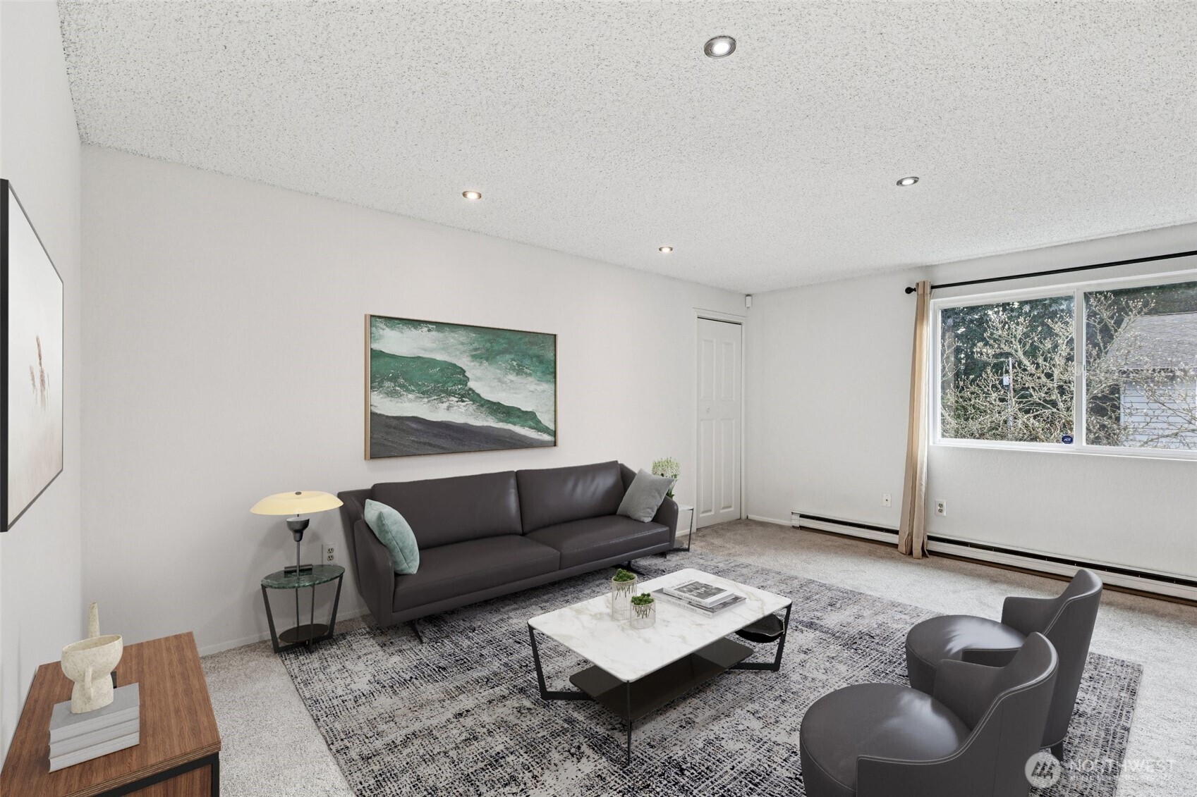 7909 218th Street Southwest, Unit 4 Edmonds, WA 98026 - Photo 7 of 29 a living room with furniture and a rug