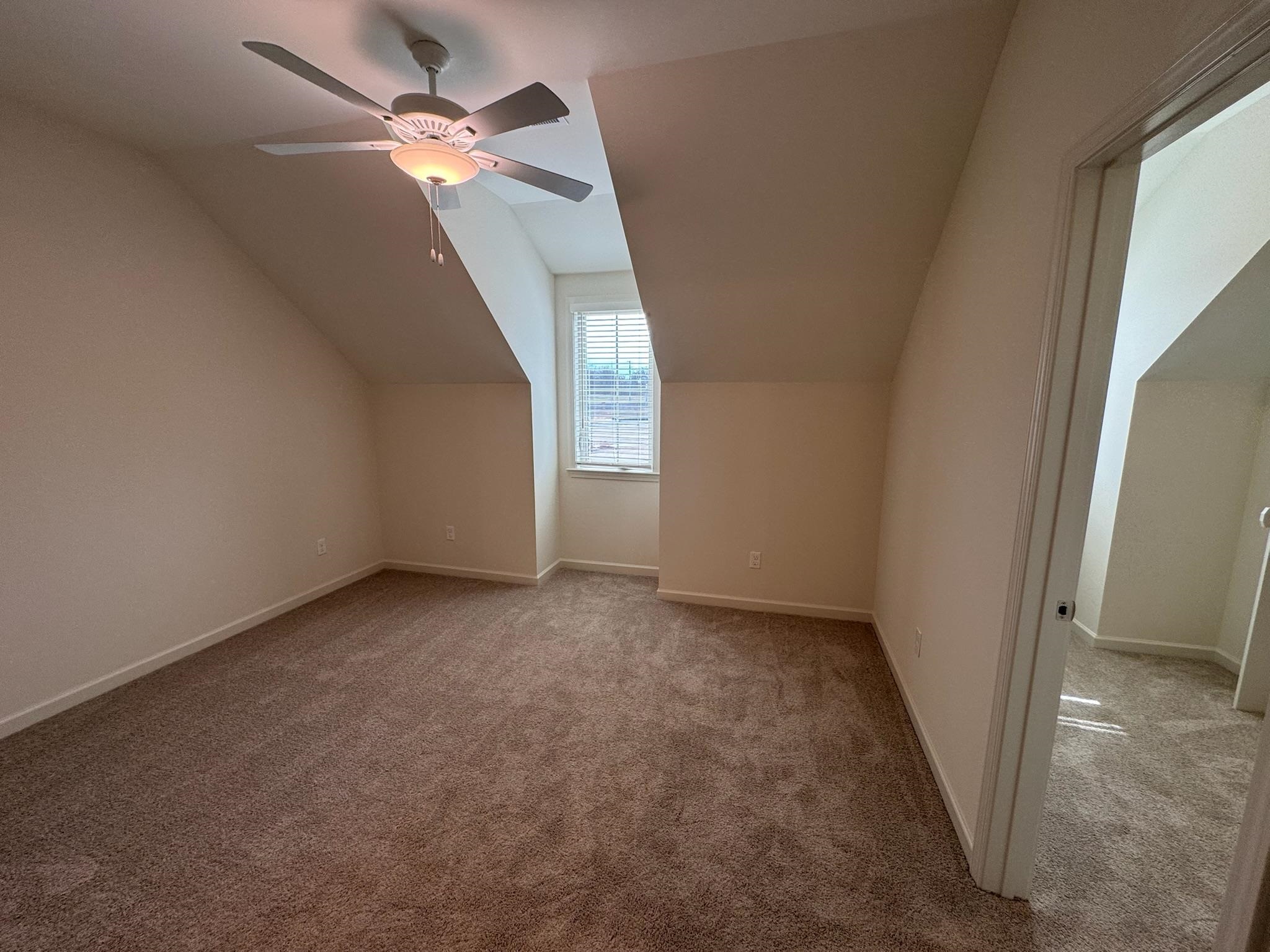 11512 Sunsparkler Way Collierville, TN 38017 - Photo 30 of 40 Bonus room featuring lofted ceiling, ceiling fan, and carpet floors