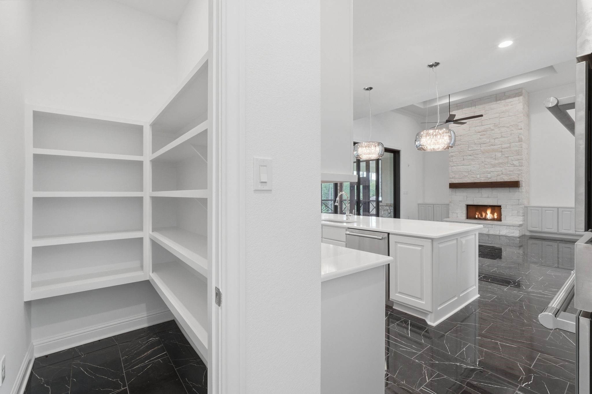 16081 Forest Mill Road Willis, TX 77378 - Photo 16 of 37 Spacious walk-in pantry offers ample shelving and convenient access to kitchen.