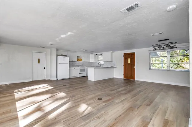 a view of kitchen with wooden floor