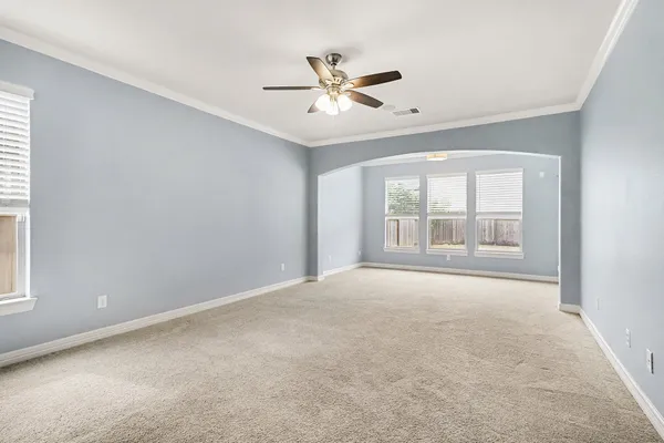 a view of an empty room with a window