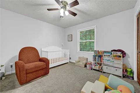 a bedroom with furniture and a window
