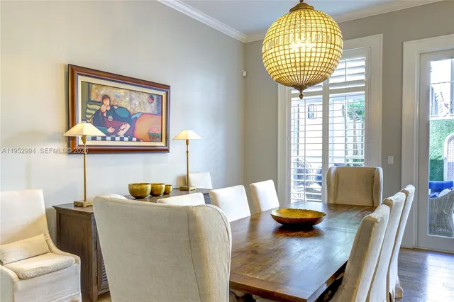a view of a dining room with furniture and a window