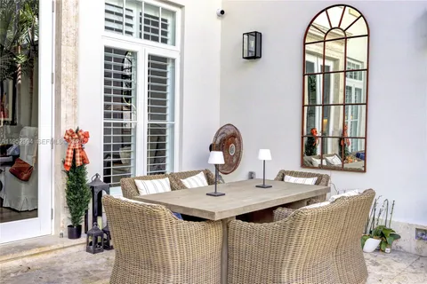 a view of a room that has a bed and a window