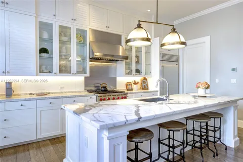a kitchen with cabinets a sink and appliances