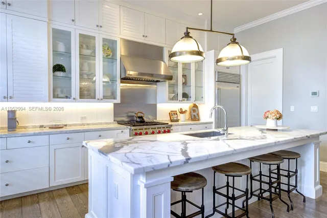 a kitchen with cabinets a sink and appliances