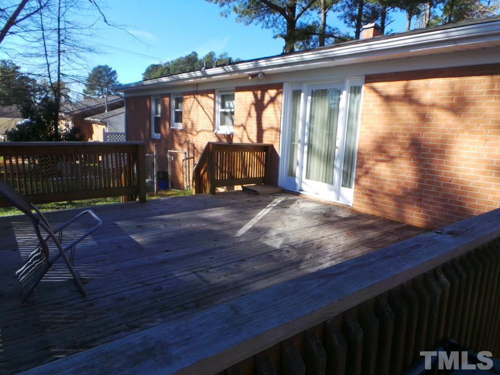 311 Pine Tree Road Oxford, NC 27565 - Photo 18 of 19 This shows another view of the deck. This photo emphasizes the striking door with side windows that leads into the Dining area.