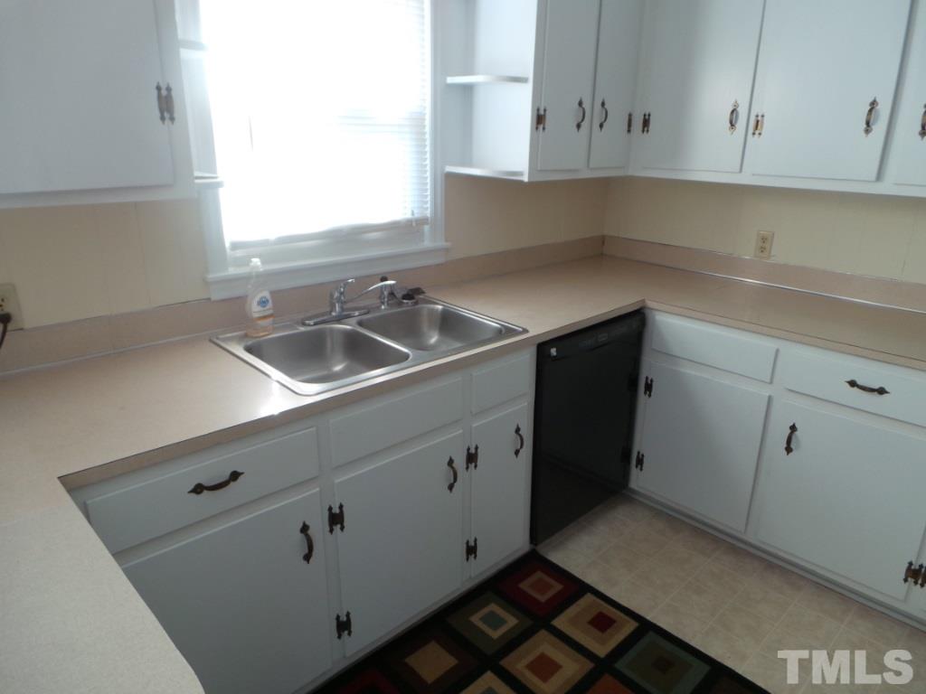 311 Pine Tree Road Oxford, NC 27565 - Photo 5 of 19 This shows the view of the kitchen. Note the double stainless steel sink and ample counter space.