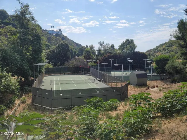 a view of a garden with sitting area
