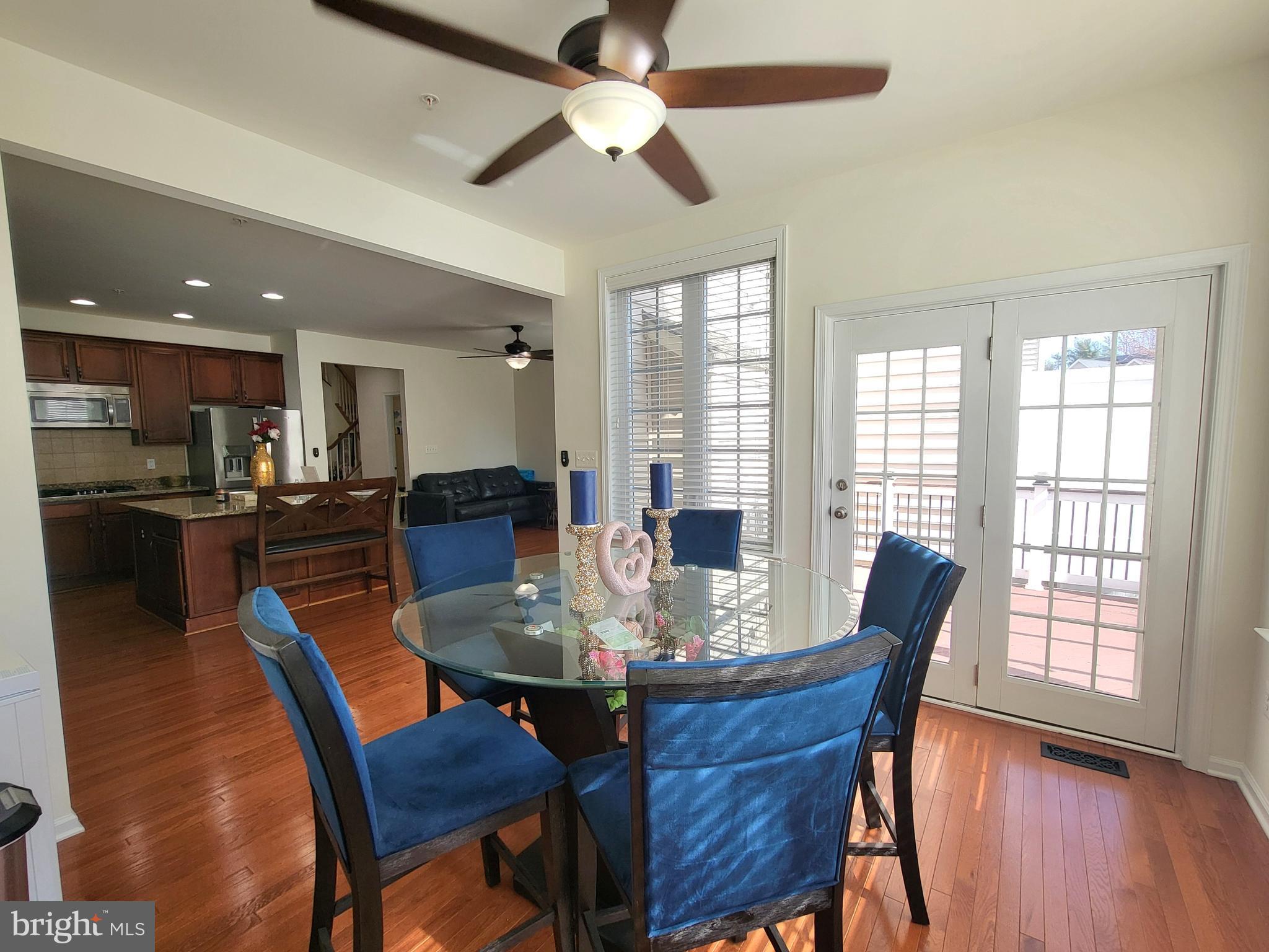 11011 Buggy Path Upper Marlboro, MD 20772 - Photo 21 of 82 a view of a dining room with furniture window and wooden floor