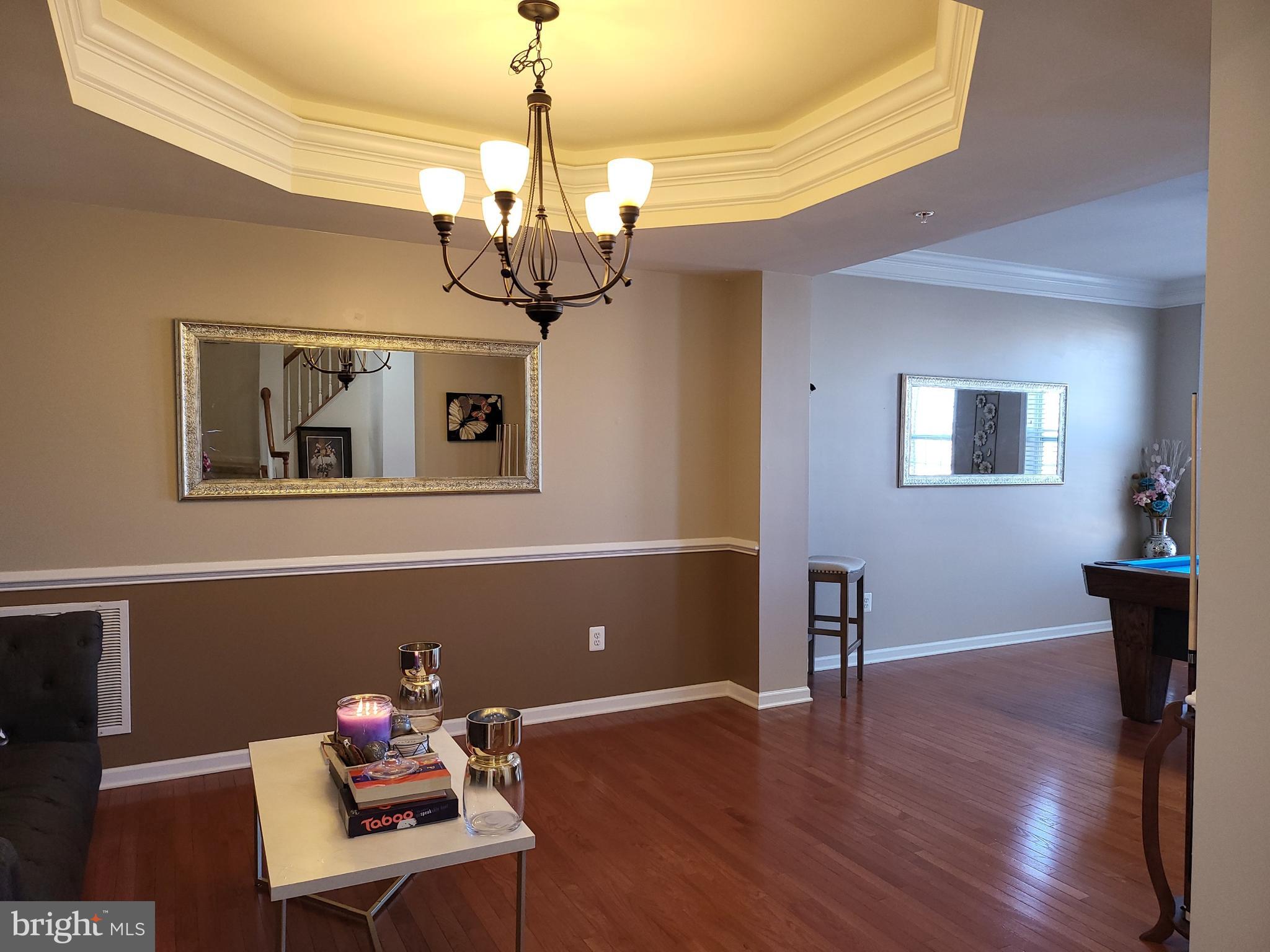 11011 Buggy Path Upper Marlboro, MD 20772 - Photo 5 of 82 a view of a livingroom with a furniture wooden floor and windows
