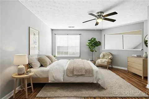 a bedroom with bed and window