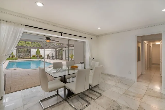 a kitchen with granite countertop a refrigerator stove and microwave