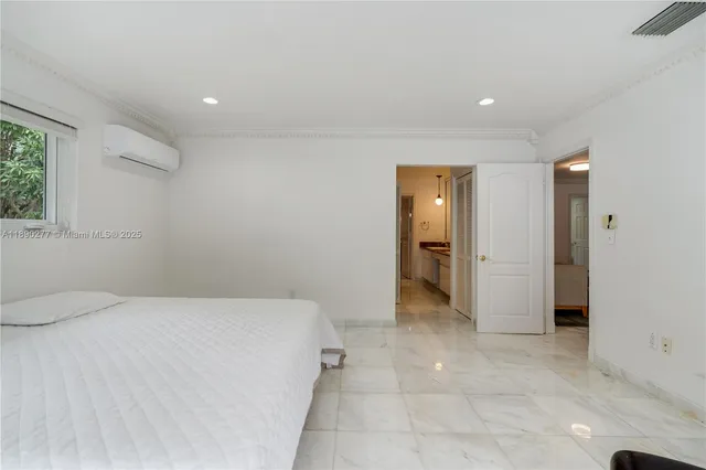 a bathroom with a granite countertop shower a toilet and a sink