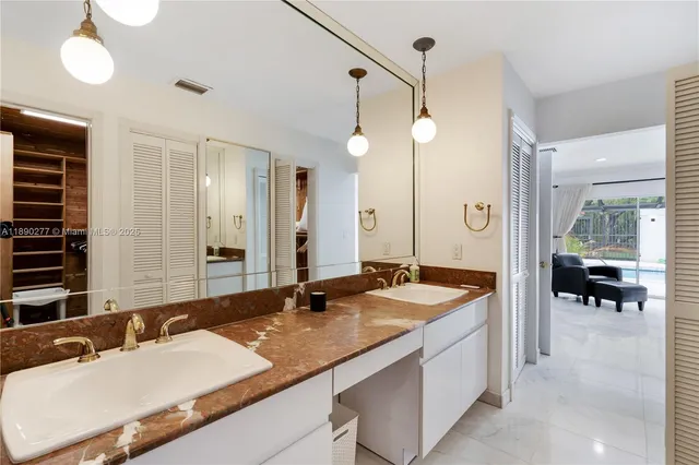 a bathroom with a double vanity sink mirror and double
