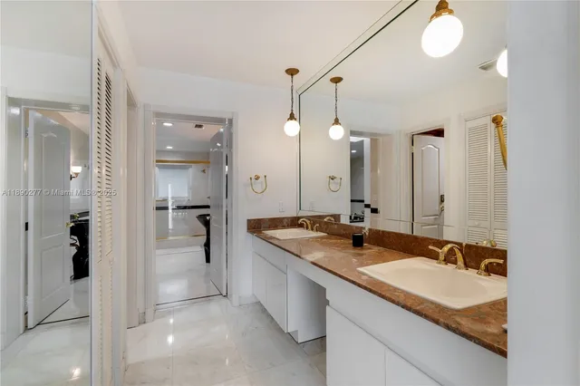 a spacious bathroom with a shower and a sink