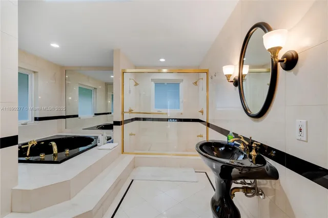 a bathroom with a granite countertop toilet and a shower