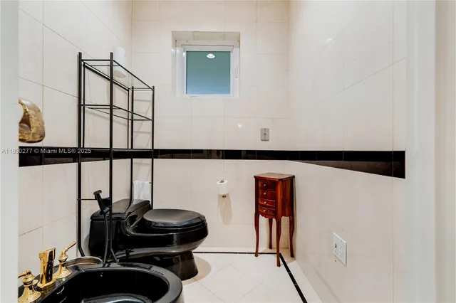 a living room with furniture a rug and a table