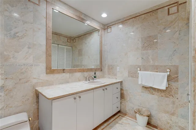 a living room with furniture and a painting on the wall