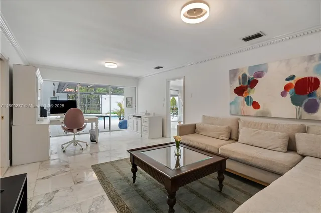 a view of a kitchen with a sink and wooden floor