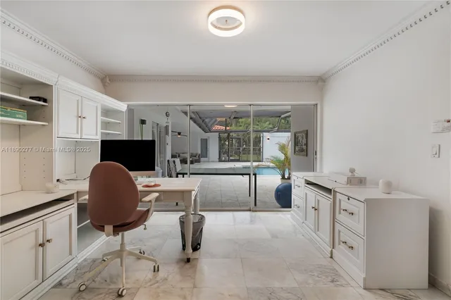 a view of a patio with a table and chairs