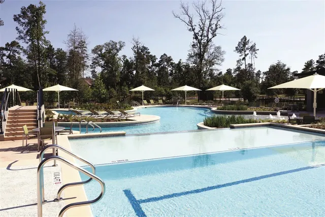 a view of a swimming pool with chairs