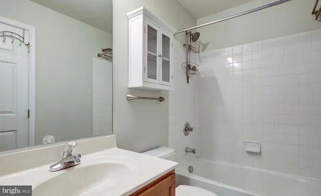 a bathroom with a sink toilet tub and shower