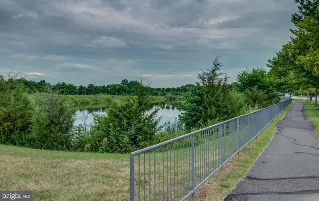 a view of a balcony with a yard