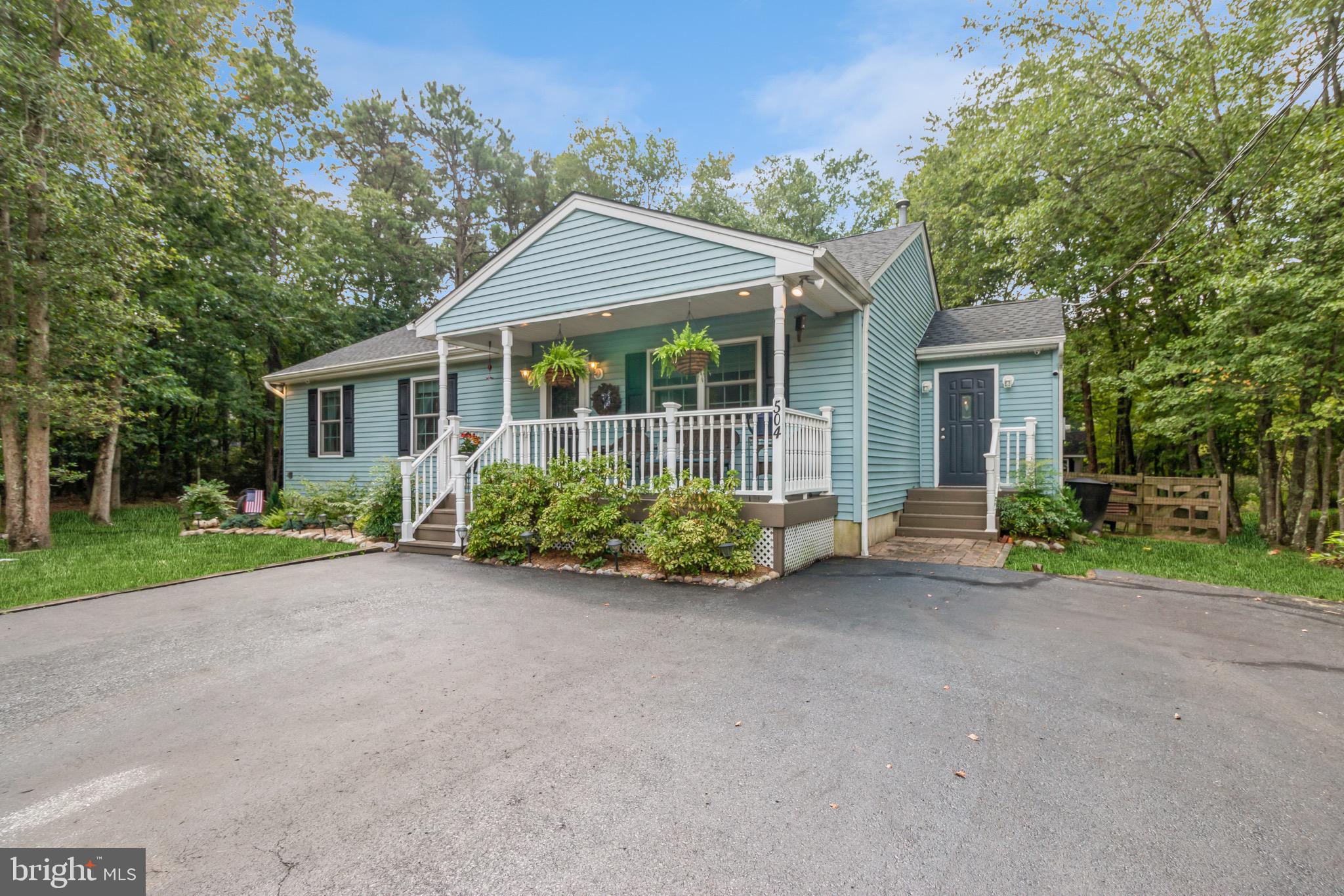 504 Tuckerton Road Medford, NJ 08055 - Photo 2 of 24 front view of a house with a garden