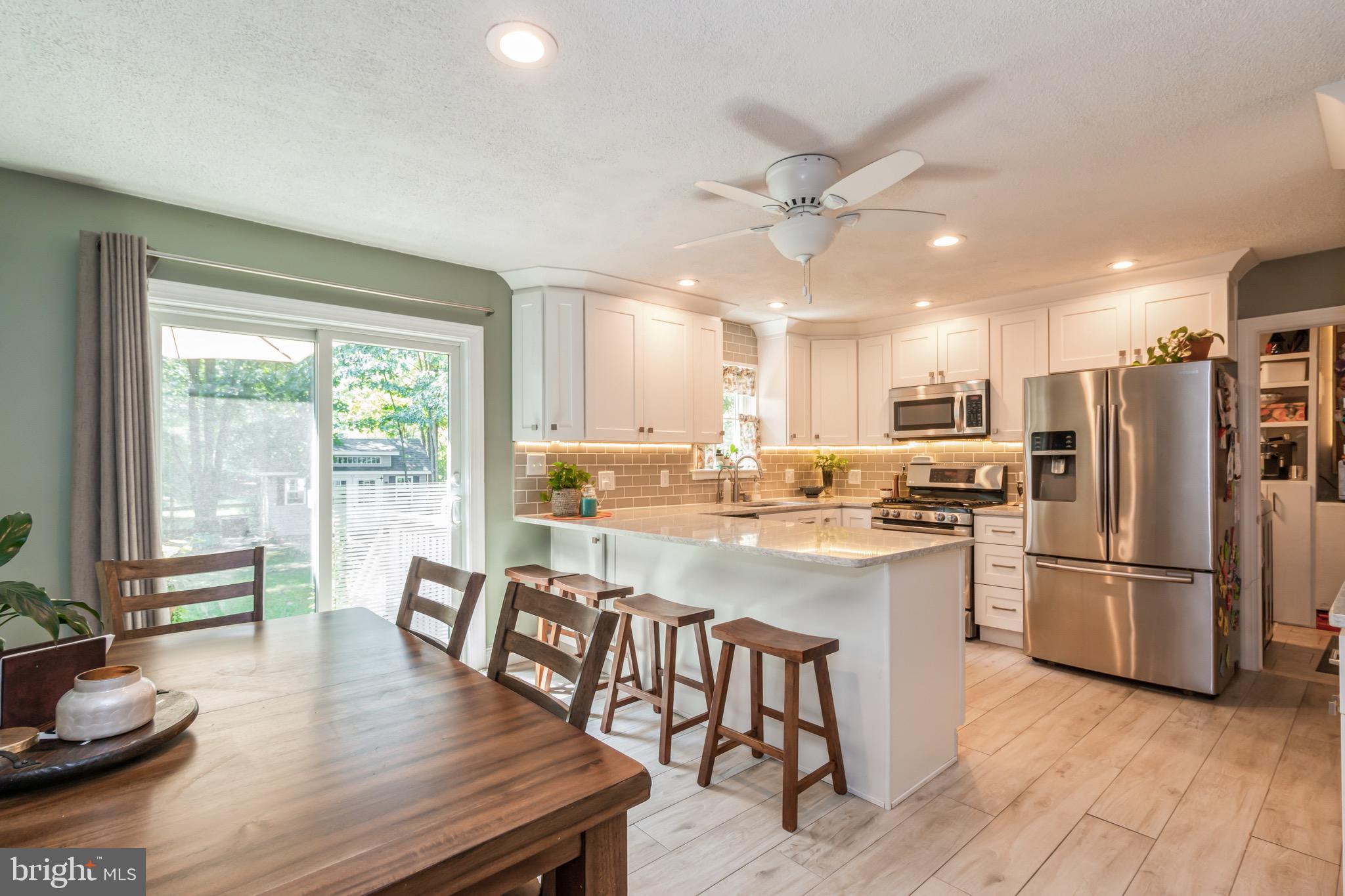 504 Tuckerton Road Medford, NJ 08055 - Photo 7 of 24 a kitchen with refrigerator cabinets and wooden floor