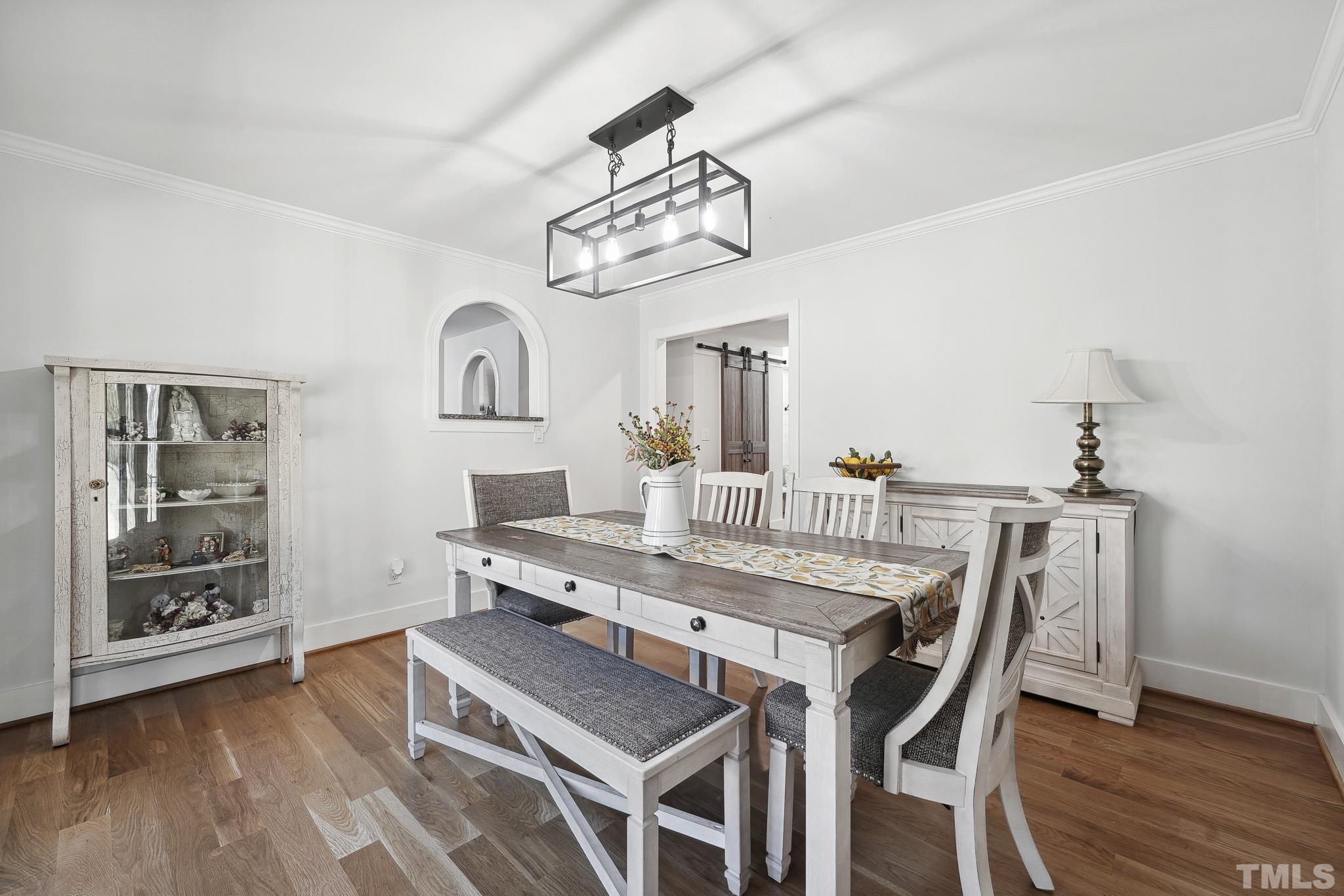 2632 Purnell Road Wake Forest, NC 27587 - Photo 15 of 60 a view of a dining room with furniture and wooden floor
